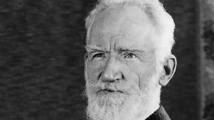 Black and white portrait of an elderly man with white hair and beard.