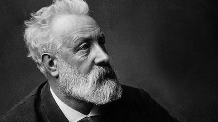 Black and white portrait of an elderly man with white hair and beard.