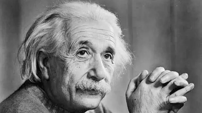 Black and white portrait of Albert Einstein with thoughtful expression.