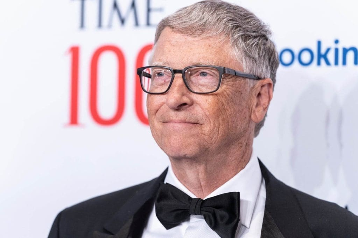 A distinguished man in a tuxedo and glasses at an event.